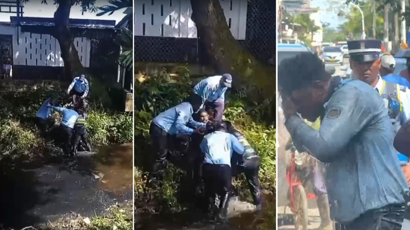 Para evitar que el motociclista siguiera atacando su compañero, varios agentes de tránsito de Turbo tuvieron que reducir al agresor. Foto: Cortesía